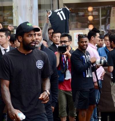 American professional basketball player Kyrie Irving of the Brooklyn Nets of the National Basketball Association NBA, Basketball Herren, USA , left, shows up at a hotel before a NBA Oversea Game against Lakers in Shanghai, China, 8 October 2019.