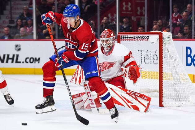 NHL, Montreal Canadiens - Detroit Red Wings MONTREAL, QC - OCTOBER 10: Montreal Canadiens center Jesperi Kotkaniemi (15) jumps and tries to deviate a shot on Detroit Red Wings goalie Jonathan Bernier (45) during the Detroit Red Wings versus the Montreal Canadiens game on October 10, 2019, at Bell Centre in Montreal, QC (Photo by David Kirouac Icon Sportswire) NHL, Eishockey Herren, USA OCT 10 Red Wings at Canadiens Icon191010031