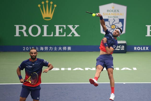 Juan Sebastian Cabal of Colombia and Robert Farah Maksoud of Colombia compete against Mate Pavic of Croatia and Bruno Soares of Brazil during the quarterfinal of men s doubles at 2019 Rolex Shanghai Masters, in Shanghai, China, 11 October 2019. Juan Sebastian Cabal of Colombia and Robert Farah Maksoud of Colombia were defeated by Mate Pavic of Croatia and Bruno Soares of Brazil with 0-2 at the quarterfinal of men s doubles at 2019 Rolex Shanghai Masters, in Shanghai, China, 11 October 2019.