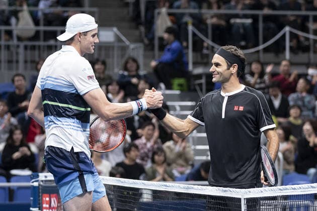 October 14, 2019, Tokyo, Japan: (L to R) John Isner shakes hands with Roger Federer after their match during the UNIQLO Life Wear Day Tokyo charity event at Ariake Coliseum. Professional tennis player Roger Federer who is UNIQLO Global Ambassador took part in a charity event in Tokyo. Federer announced his plans to compete at the Tokyo 2020 Olympics Games. Roger Federer plans to compete in the Tokyo 2020 Olympic Games, Olympische Spiele, Olympia, OS - ZUMAm191 20191014_zap_m191_035 Copyright: xRodrigoxReyesxMarinx