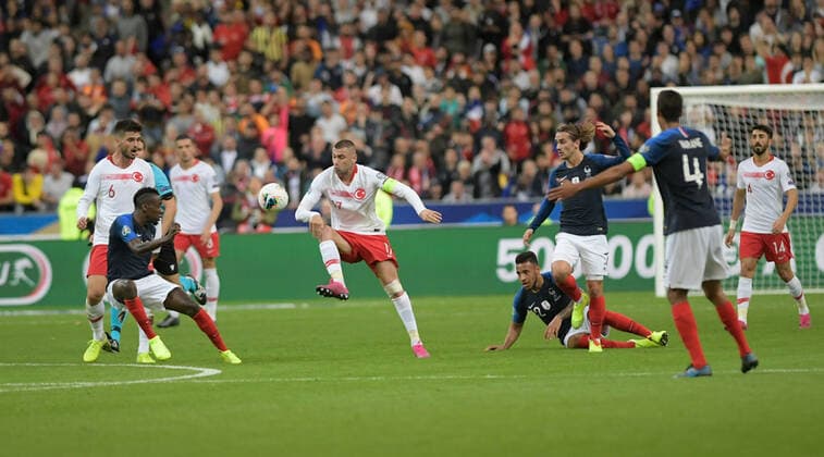 Burak Yilmaz of Turkey and Corentin Tolisso 12 , Antoine Griezmann of France during the European Championship, EM, Europameisterschaft qualification Group H Match between France and Turkey at Stade de France in Saint-denis , France on October 14 , 2019. 