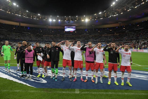 Turkey Players Merih Demiral 3 , Burak Yilmaz 17 , Yusuf Yazici 11 , Irfan Can Kahveci 21 , Ozan Tufan and Umut Meras (R) celebrates victory with Turkish Fans after the European Championship, EM, Europameisterschaft qualification Group H Match between France and Turkey at Stade de France in Saint-denis , France on October 14 , 2019. 