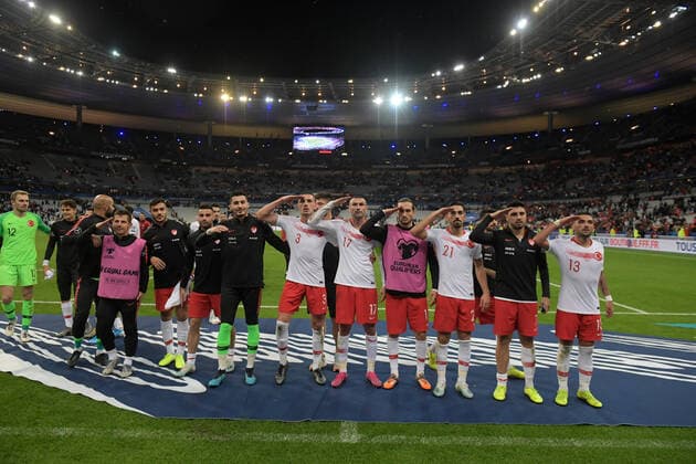 Turkey Players Merih Demiral 3 , Burak Yilmaz 17 , Yusuf Yazici 11 , Irfan Can Kahveci 21 , Ozan Tufan and Umut Meras (R) celebrates victory with Turkish Fans after the European Championship, EM, Europameisterschaft qualification Group H Match between France and Turkey at Stade de France in Saint-denis , France on October 14 , 2019. 