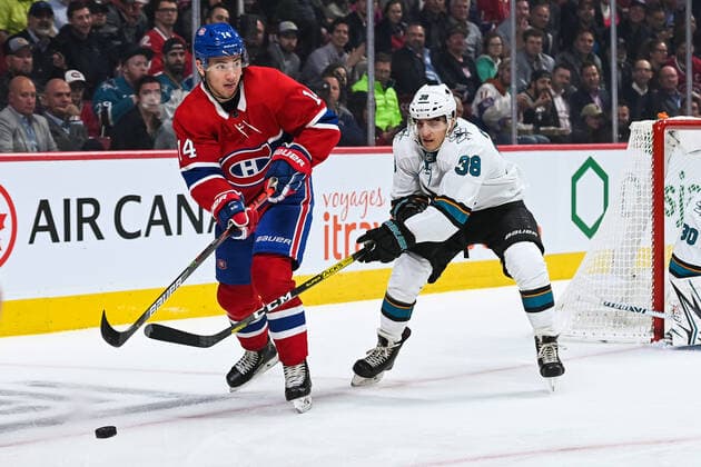MONTREAL, QC - OCTOBER 24: Montreal Canadiens center Nick Suzuki (14) considers his options with the puck while under pressure from San Jose Sharks defenceman Mario Ferraro (38) during the San Jose Sharks versus the Montreal Canadiens game on October 24, 2019, at Bell Centre in Montreal, QC (Photo by David Kirouac Icon Sportswire) NHL, Eishockey Herren, USA OCT 24 Sharks at Canadiens Icon191024004
