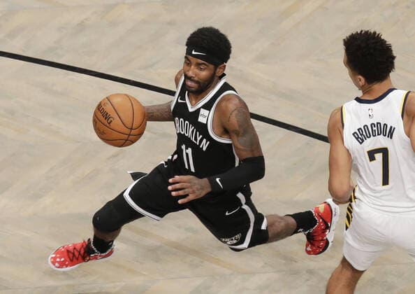 Brooklyn Nets Kyrie Irving drives to the basket past Indiana Pacers Malcolm Brogdon in the first half at Barclays Center on Wednesday, October 30, 2019 in New York City.  NYP20191030132 JOHNxANGELILLO