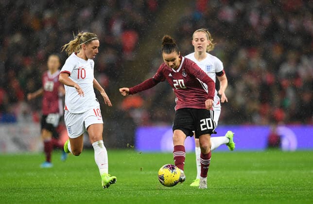 9th November 2019; Wembley Stadium, London, England; International Womens Football Friendly, England women versus Germany women; Lina Magull of Germany plays the ball through under pressure from Jordan Nobbs of England - Editorial Use  ActionPlus12186021 SimonxWest