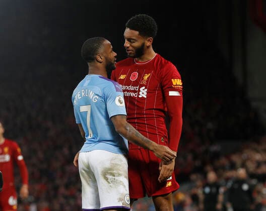 Raheem Sterling of Manchester City and Joe Gomez of Liverpool square up to each other during the Premier League match at Anfield, Liverpool. Picture date: 10th November 2019. Picture credit should read: Darren Staples Sportimage EDITORIAL USE ONLY. No use with unauthorised audio, video, data, fixture lists, club league logos or live services. Online in-match use limited to 120 images, no video emulation. No use in betting, games or single club league player publications. SPI-0311-0080