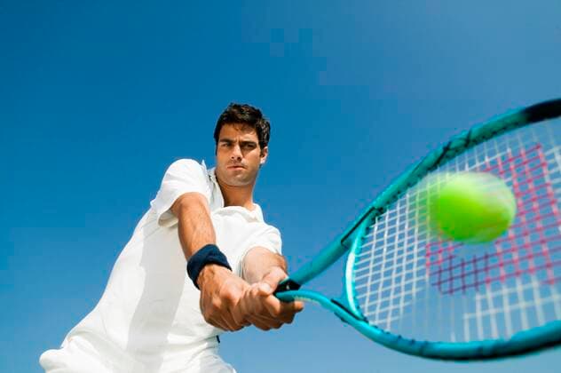 Tennis Player Hitting Ball 03B77664