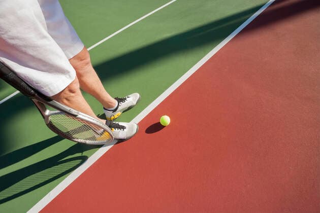 Low section of male tennis player on court ING_19064_01908