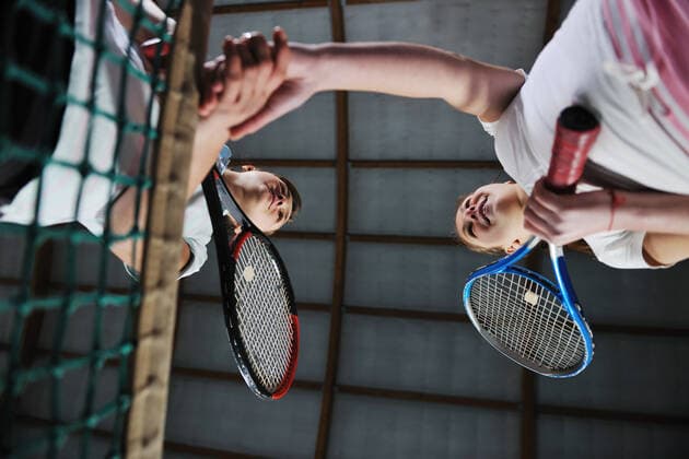 young girls playing tennis game indoori in tennis court ING_32193_35123