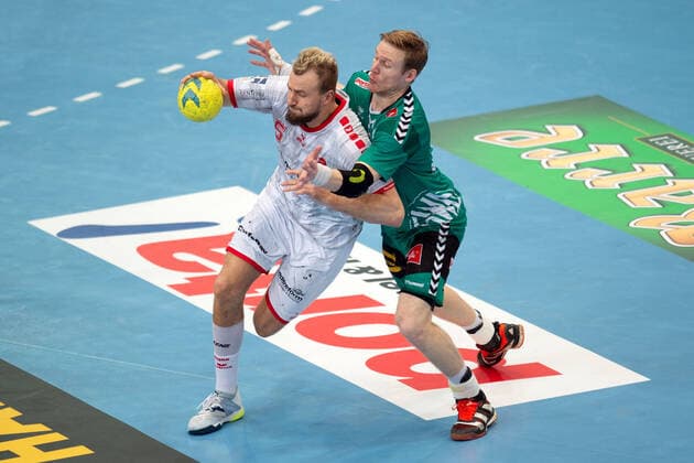Minden, Deutschland 14.11.2019: 1. Handball-Bundesliga - 2019 2020 - GWD Minden vs. MT Melsungen (L-R) Julius Kühn (Melsungen), Magnus Gullerud (Minden) Minden Nordrhein-Westfalen Deutschland Kampa Halle