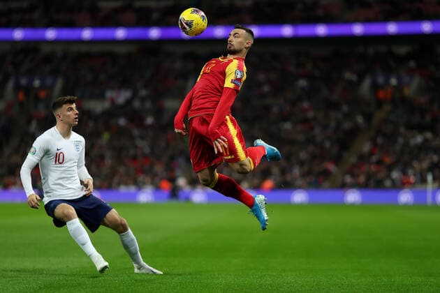 14th November 2019; Wembley Stadium, London, England; European Championships 2020 Qualifier, England versus Montenegro; Saed Haksabanovic of Montenegro controls the ball past Mason Mount of England - Editorial Use  ActionPlus12187946 ShaunxBrooks