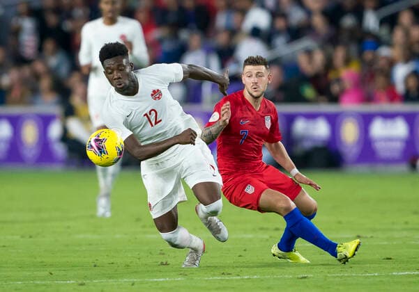 ORLANDO, FL - NOVEMBER 15: Canada midfielder Alphonso Davies (12) takes possession of the ball during the CONCACAF Nations League soccer match between the Canada and United States on November 15, 2019 at Explorer Stadium in Orlando, FL. (Photo by Andrew Bershaw Icon Sportswire) SOCCER: NOV 15 CONCACAF Nations League - USA v Canada Icon1911150311