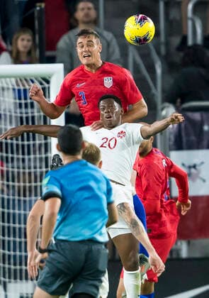 ORLANDO, FL - NOVEMBER 15: the United States defender Aaron Long (3) and Canada forward Jonathan David (20) got up for a header during he CONCACAF Nations League soccer match between the Canada and United States on November 15, 2019 at Explorer Stadium in Orlando, FL. (Photo by Andrew Bershaw Icon Sportswire) SOCCER: NOV 15 CONCACAF Nations League - USA v Canada Icon1911150548