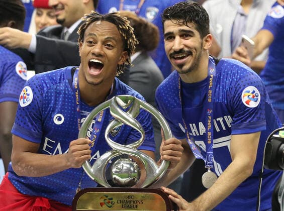 November 24, 2019, Saitama, Japan - Saudi Arabia s Al Hilal SFC members Andre Carrillo (L) and Abdullah Alhafith (R) celebrate their victory of AFC Champions League at the final in Saitama, suburban Tokyo on Sunday, November 24, 2019. Al Hilal SFC defeated Urawa Reds 2-0 in the second match of the ACL finals. Noxthirdxpartyxsales  (117237833)