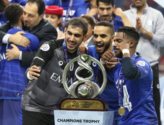 November 24, 2019, Saitama, Japan - Saudi Arabia s Al Hilal SFC members Mohammed Ahmed Alwakid (L), Mohammed Alburayk (C) and Nawaf Shaker Alabid (R) celebrate their victory of AFC Champions League at the final in Saitama, suburban Tokyo on Sunday, November 24, 2019. Al Hilal SFC defeated Urawa Reds 2-0 in the second match of the ACL finals. Noxthirdxpartyxsales  (117237834)