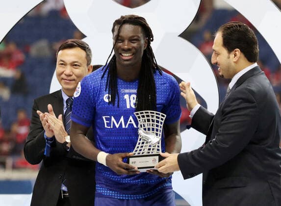 November 24, 2019, Saitama, Japan - Saudi Arabia s Al Hilal SFC Bafetimbi Gomis receives the trophy as the team won the AFC Champions League at the final in Saitama, suburban Tokyo on Sunday, November 24, 2019. Al Hilal SFC defeated Urawa Reds 2-0 in the second match of the ACL finals. Noxthirdxpartyxsales  (117237838)