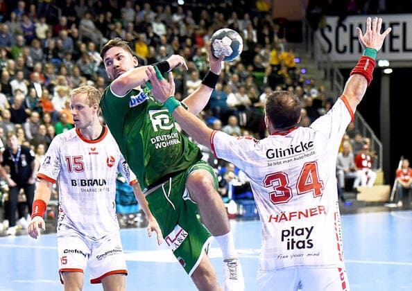 28.11.2019, xlakx, Handball Bundesliga, Fuechse Berlin - MT Melsungen emspor, v.l.Lasse Mikkelsen (MT Melsungen 15),zum Sprungwurf Fabian Wiede(Fuechse Berlin 3),Kai Haefner (MT Melsungen 34) Berlin