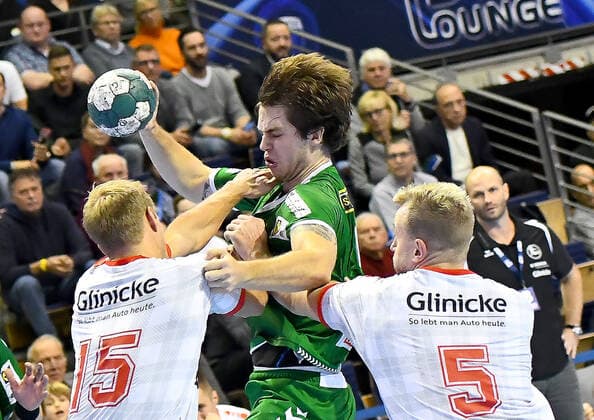 28.11.2019, xlakx, Handball Bundesliga, Fuechse Berlin - MT Melsungen emspor, v.l.Lasse Mikkelsen (MT Melsungen 15),am Ball Jacob Tandrup Holm(Fuechse Berlin 6),Julius Kuehn (MT Melsungen 5) Berlin