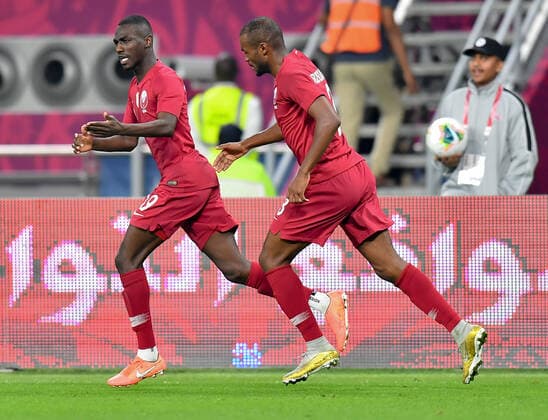 (191130) -- DOHA, Nov. 30, 2019 -- Al Moez Ali (L) of Qatar celebrates after scoring against Yemen during the 24th Arabian Gulf Cup 2019 Group A football match at the Khalifa International Stadium in Doha, capital of Qatar, Nov. 29, 2019. Qatar won 6-0. Nikku) (SP)QATAR-DOHA-FOOTBALL-ARABIAN GULF CUP-QATAR VS YEMEN yangyuanyong 
