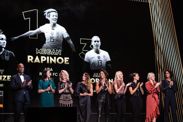 (191203) -- PARIS, Dec. 3, 2019 (Xinhua) -- Megan Rapinoe of the United States is seen on the screen after she awarded as the best female soccer player during the Ballon d Or 2019 awards ceremony at the Theatre du Chatelet in Paris, France, Dec. 2, 2019. (Photo by Aurelien Morissard Xinhua) (SP)FRANCE-PARIS-SOCCER-BALLON D OR 2019 AWARDS 