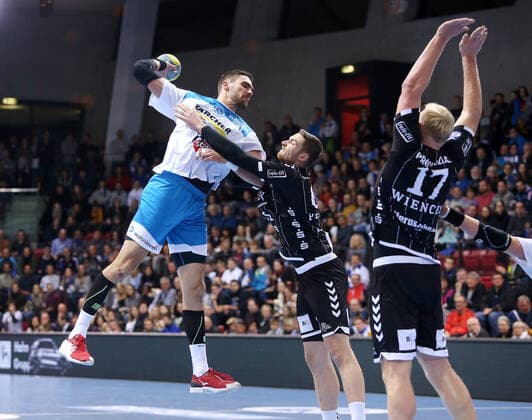 BAU 03.12.2019 Stuttgart Handball TVB Stuttgart vs. THW Kiel, v.l. Dominik Weiß (TVB), Hendrik Pekeler (Kiel)