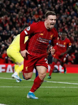 Xherdan Shaqiri of Liverpool celebrates scoring their second goalduring the Premier League match at Anfield, Liverpool. Picture date: 4th December 2019. Picture credit should read: James Wilson Sportimage EDITORIAL USE ONLY. No use with unauthorised audio, video, data, fixture lists, club league logos or live services. Online in-match use limited to 120 images, no video emulation. No use in betting, games or single club league player publications. SPI-0351-0024
