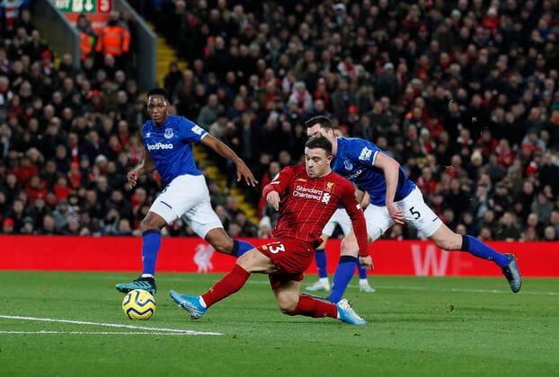 Xherdan Shaqiri of Liverpool scores the second goal during the Premier League match at Anfield, Liverpool. Picture date: 4th December 2019. Picture credit should read: James Wilson Sportimage EDITORIAL USE ONLY. No use with unauthorised audio, video, data, fixture lists, club league logos or live services. Online in-match use limited to 120 images, no video emulation. No use in betting, games or single club league player publications. SPI-0351-0025
