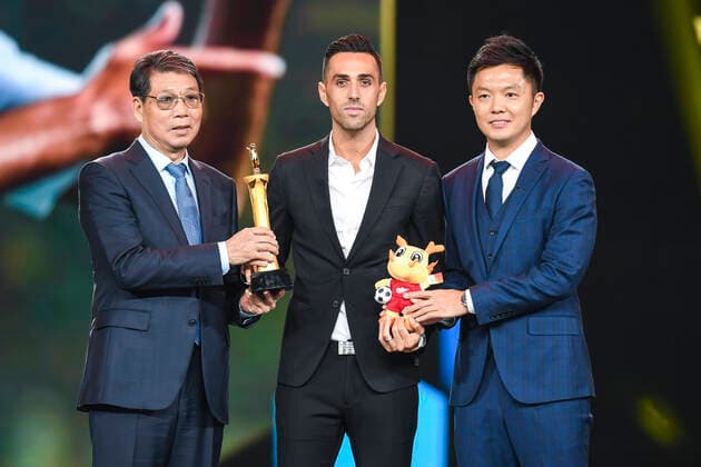 Israeli football player Eran Zahavi from Guangzhou R&F F.C., middle, wins the award of top scorer during 2019 Ping An Chinese Football Association Super League Award Ceremony in Shanghai, China, 7 December 2019.