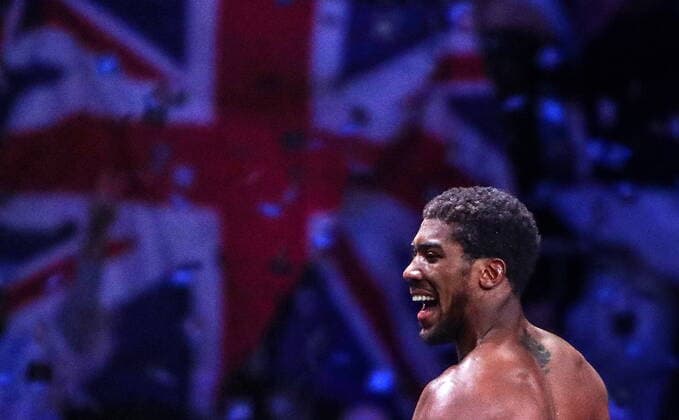 GroÃŸbritannien, Black History Month im Oktober - Sport SAUDI ARABIA - DECEMBER 7, 2019: British boxer Anthony Joshua celebrates winning a bout against his American rival Andy Ruiz Jr and regaining his IBO, WBA Super, IBF and WBO World Heavy Titles at Diriyah Arena outside Riyadh. Valery Sharifulin TASS  TS0C68D2