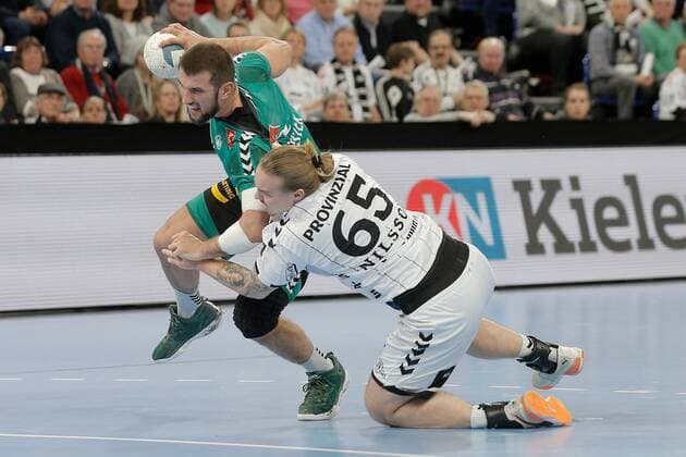 1.Handball Bundesliga THW Kiel - TSV GWD Minden, Kiel, 8.12.2019 Lucas Meister ( Minden, 2) im Zweikampf gegen Lukas Nilsson ( Kiel, 65 ). Copyright: xBEAUTIFULxSPORTS DRPx