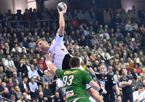 12.12.2019, xlakx, Handball Bundesliga, Fuechse Berlin - THW Kiel emspor, v.l.zum Sprungwurf Harald Reinkind (THW Kiel 6),Mijajlo Marsenic(Fuechse Berlin 93) Berlin
