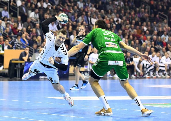 12.12.2019, xlakx, Handball Bundesliga, Fuechse Berlin - THW Kiel emspor, v.l. am Ball Miha Zarabec (THW Kiel 24),Marko Kopljar(Fuechse Berlin 35) Berlin