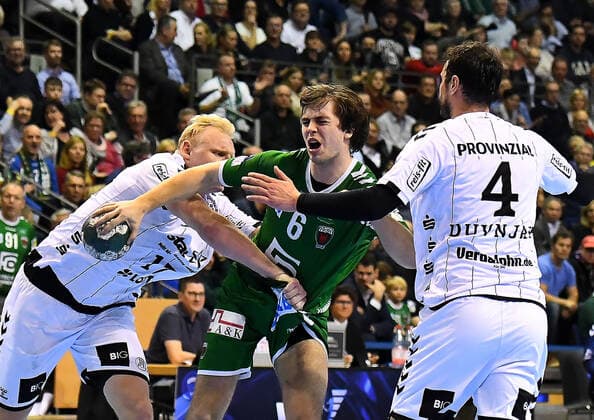 12.12.2019, xlakx, Handball Bundesliga, Fuechse Berlin - THW Kiel emspor, v.l.Patrick Wiencek (THW Kiel 17),am Ball Jacob Tandrup Holm(Fuechse Berlin 6),Domagoj Duvnjak (THW Kiel 4) Berlin