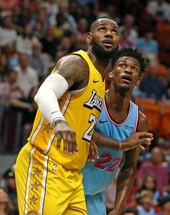 December 13, 2019, Miami, FL, USA: The Los Angeles Lakers LeBron James, left, jostles for position under the basket with the Miami Heat s Jimmy Butler (22) in the second quarter at the AmericanAirlines Arena in Miami on Friday, Dec. 13, 2019. LA Lakers at Miami - ZUMAm67_ 20191213_zaf_m67_017 Copyright: xDavidxSantiagox