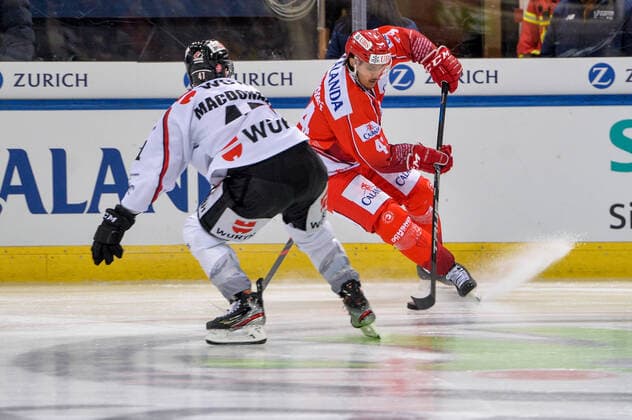 26.12.2019, Davos, Vaillant Arena, Spengler Cup: HC Trinec - Team Canada, Matej Stransky (Ocelari Trinec) against Andrew MacDonald (Team Canada) Davos Vaillant Arena Graubünden Schweiz Copyright: xJustPictures.ch AndreaxBrancax
