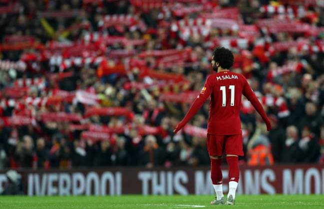 29th December 2019; Anfield, Liverpool, Merseyside, England; English Premier League Football, Liverpool versus Wolverhampton Wanderers; Mohammed Salah of Liverpool in front of Liverpool fans with their scarves raised as they sing "You ll Never Walk Alone" prior to the kick off - Strictly Editorial Use Only. No use with unauthorized audio, video, data, fixture lists, club league logos or live services. Online in-match use limited to 120 images, no video emulation. No use in betting, games or single club league player publications  ActionPlus12199331 DavidxBlunsden