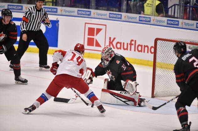 Grigori Denisenko of Russia, left, and Canadian goalkeeper Joel Hofer in action during the 2020 IIHF World Junior Ice hockey, Eishockey Championships final game between Russia and Canada in Ostrava, Czech Republic, on January 5, 2020. (CTKxPhoto JaroslavxOzana) CTKPhotoP202001050664901  JAO 06
