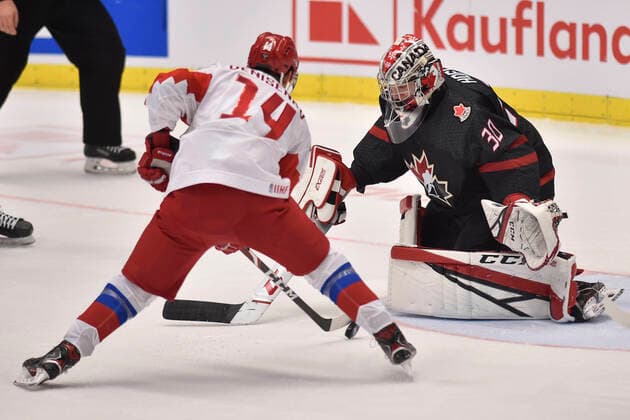 Grigori Denisenko of Russia, left, and Canadian goalkeeper Joel Hofer in action during the 2020 IIHF World Junior Ice hockey, Eishockey Championships final game between Russia and Canada in Ostrava, Czech Republic, on January 5, 2020. (CTKxPhoto JaroslavxOzana) CTKPhotoP202001050665901  JAO 06