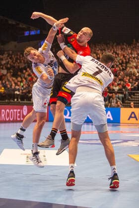 HANDBALL - AUT vs GER, test match VIENNA,AUSTRIA,06.JAN.20 - HANDBALL - OEHB international match, Länderspiel, Nationalmannschaft Austria vs Germany, test match. Image shows Lukas Herbuger (AUT), Paul Drux (GER) and Janko Bozovic (AUT).. GEPAxpictures xDavidxBitzan