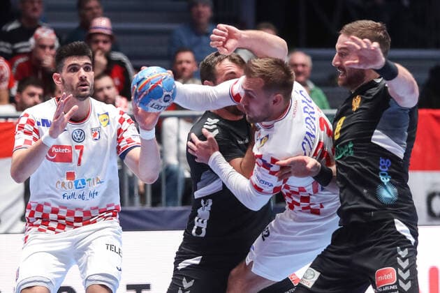 Croatia vs Montenegro: Group A - Men s EHF EURO 2020 GRAZ, AUSTRIA - JANUARY 09: Luka Cindric of Croatia is challenged by Vuk Lazovic of Montenegro during the Men s EHF EURO 2020 group A match between Croatia and Montenegro at Stadthalle on January 9, 2020 in Graz, Austria.  LukaxStanzl PIXSELL