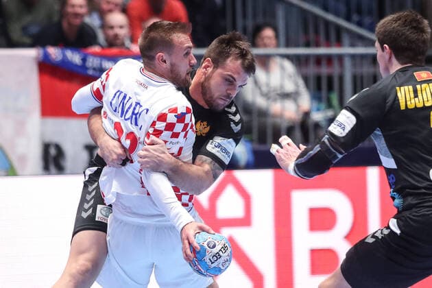 Croatia vs Montenegro: Group A - Men s EHF EURO 2020 GRAZ, AUSTRIA - JANUARY 09: Luka Cindric of Croatia is challenged by Vuk Lazovic of Montenegro during the Men s EHF EURO 2020 group A match between Croatia and Montenegro at Stadthalle on January 9, 2020 in Graz, Austria.  LukaxStanzl PIXSELL
