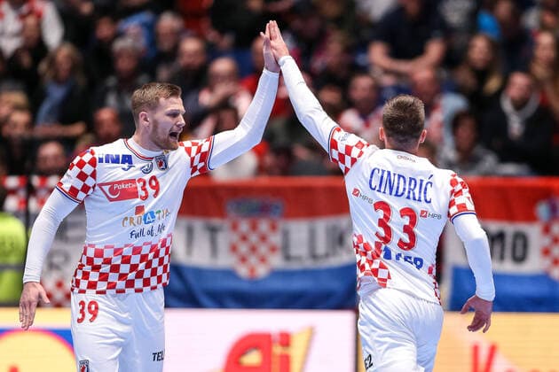 Croatia vs Montenegro: Group A - Men s EHF EURO 2020 GRAZ, AUSTRIA - JANUARY 09: David Mandic and Luka Cindric of Croatia celebrate a point during the Men s EHF EURO 2020 group A match between Croatia and Montenegro at Stadthalle on January 9, 2020 in Graz, Austria.  LukaxStanzl PIXSELL