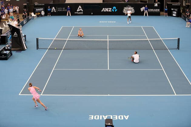 ADELAIDE INTERNATIONAL DAY 1, Simona Halep of Romania plays a shot watched by her partner Juan Sebastian Cabal of Colombia after winning point against Angelique Kerber of Germany and Robert Farah of Columbia during the Adelaide International Rally for Resilience exhibition game on day 1 of the Adelaide International tennis tournament atMemorial Drive Tennis Centre inAdelaide, Sunday, January 12, 2020. ( NO ARCHIVING, EDITORIAL USE ONLY, NO USE IN BOOKS WITHOUT CONSENT ADELAIDE SA AUSTRALIA  Copyright: xKELLYxBARNESx 20200112001441698288