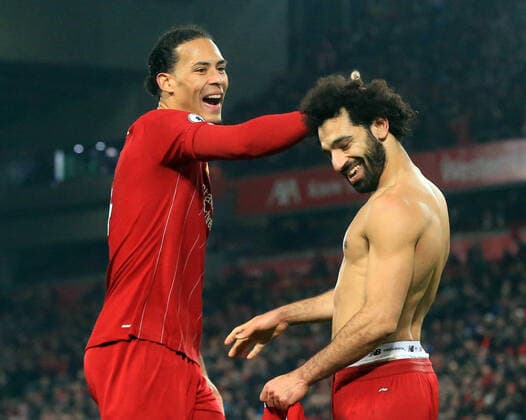 19th January 2020; Anfield, Liverpool, Merseyside, England; English Premier League Football, Liverpool versus Manchester United, ManU Mohammed Salah of Liverpool celebrates with team mate Virgil van Dijk after scoring his team s second goal after 2 minutes of extra time - Strictly Editorial Use Only. No use with unauthorized audio, video, data, fixture lists, club league logos or live services. Online in-match use limited to 120 images, no video emulation. No use in betting, games or single club league player publications  ActionPlus12205173 DavidxBlunsden