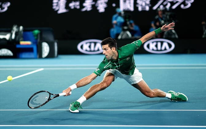 Sport Bilder des Tages AUSTRALIAN OPEN DAY 1, Novak Djokovic of Serbia stretches out to return during his first round match against Jan-Lennard Struff of Germany on day one of the Australian Open tennis tournament at Rod Laver Arena in Melbourne during day one of the Australian Open tennis tournament in Melbourne, Monday, January 20, 2020. ( NO ARCHIVING, EDITORIAL USE ONLY, NO USE IN BOOKS WITHOUT CONSENT MELBOURNE VIC AUSTRALIA  Copyright: xDAVExHUNTx 20200120001443394792