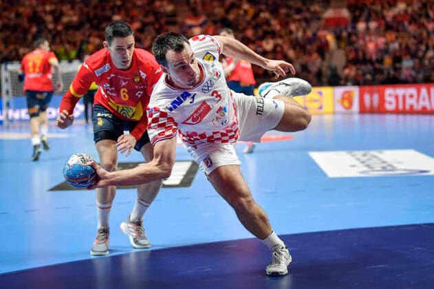 Croatia s Marino Maric with the ball and Spain s Angel Fernandez Perez (behind L) during the Men s European Handball Championship final match between Spain and Croatia in Stockholm, Sweden, on Jan. 26, 2020. Stockholm Sverige HANDBALL x10040x