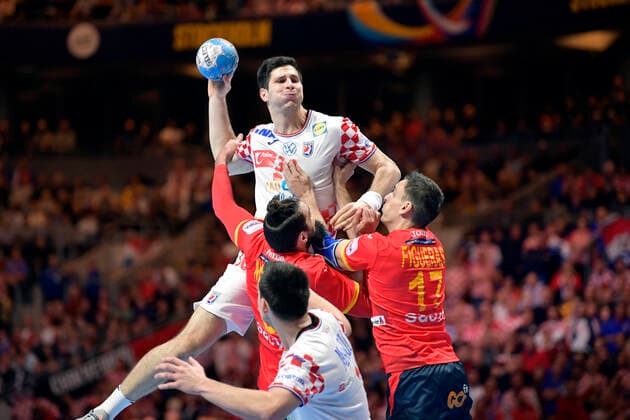 Croatia s Marino Maric with the ball against Spain s Jorge Maqueda Pena (L) and Adrian Figueras Trejo (17) during the Men s European Handball Championship final match between Spain and Croatia in Stockholm, Sweden, on Jan. 26, 2020. Stockholm Sverige HANDBALL x10040x