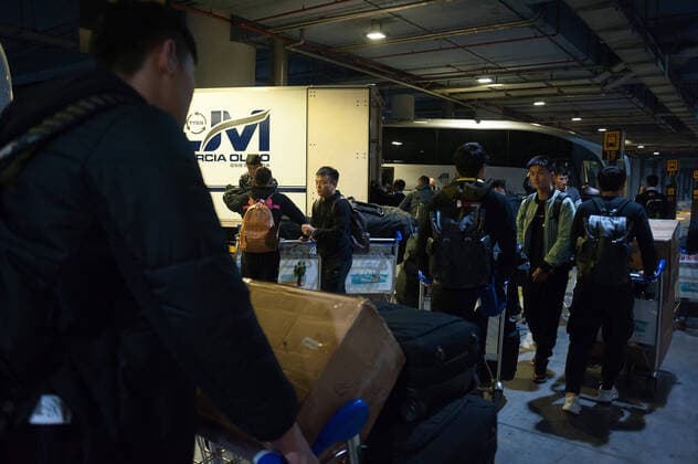 January 29, 2020, Malaga, Spain: Players prepare their bags at Malaga Costa del Sol airport..Wuhan Zall FC Chinese soccer team arrives at Malaga Costa del Sol airport for a pre-season training in Cadiz province. According to the Andalusia and Spanish government, the players are not infected with the Corona virus and during their stay, they will be subjected to health controls. The team will be in Andalusia until 15 February. Wuhan Zall FC team players in Malaga, Spain - 29 Jan 2020 - ZUMAs197 96526646st Copyright: xJesusxMeridax