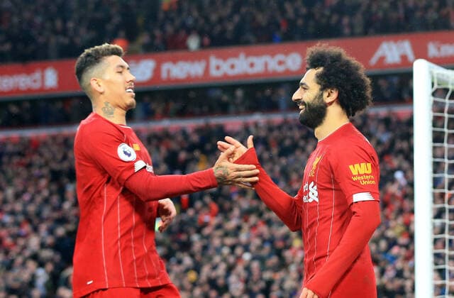 1st February 2020; Anfield, Liverpool, Merseyside, England; English Premier League Football, Liverpool versus Southampton; Mohammed Salah of Liverpool celebrates with team mate Roberto Firmino after scoring his side s third goal - Strictly Editorial Use Only. No use with unauthorized audio, video, data, fixture lists, club league logos or live services. Online in-match use limited to 120 images, no video emulation. No use in betting, games or single club league player publications  ActionPlus12208633 DavidxBlunsden